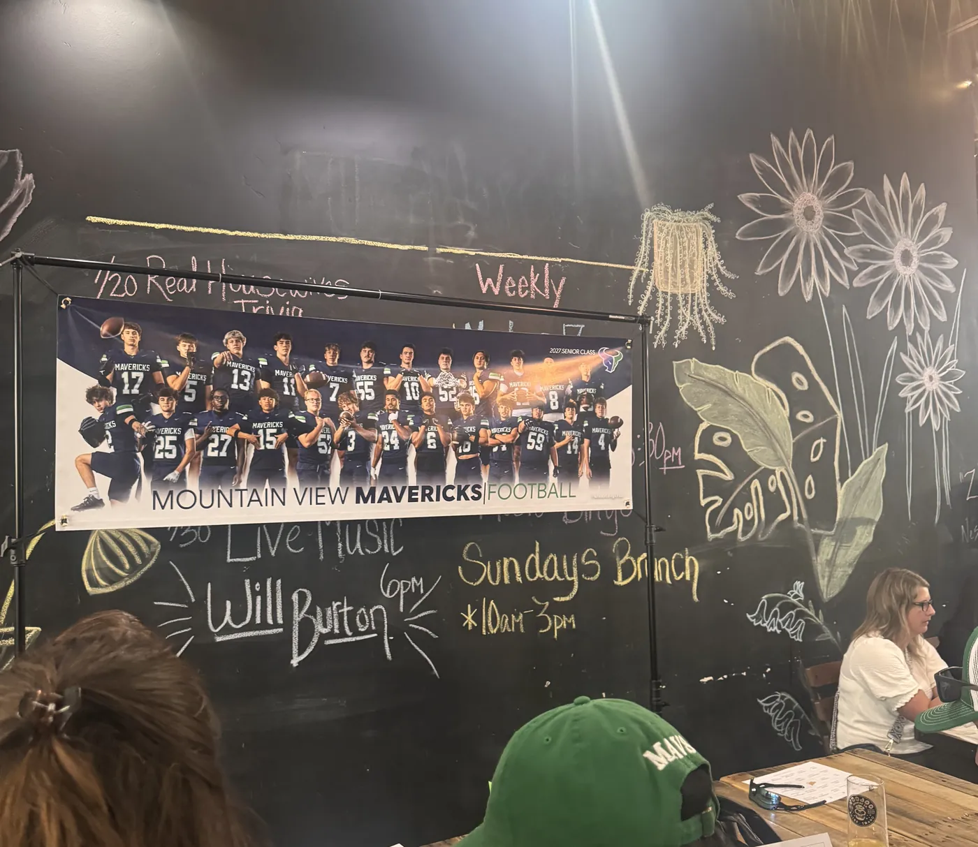 Mountain View Mavericks football team banner hanging on the chalkboard wall at Voodoo Brewing in Boise during the booster club silent auction fundraiser