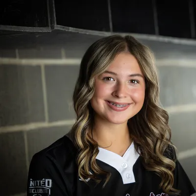 Idaho Batbusters 16U softball player dugout portrait