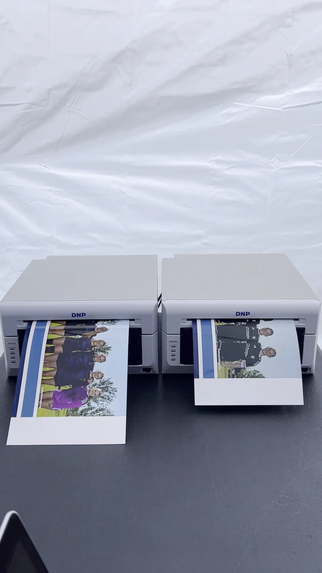 DNP DS820A printers producing 8x24 panoramic team prints on-site, same day