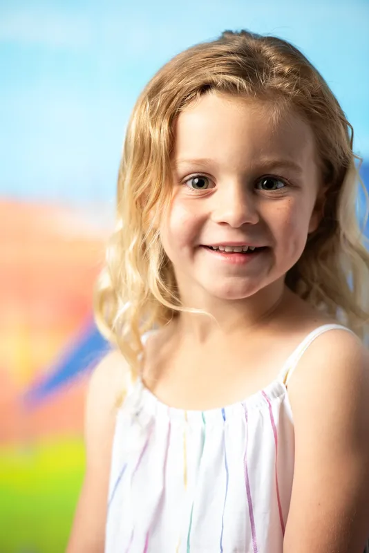 Close-up preschool photo day portrait of young girl with soft studio lighting - daycare photography Meridian