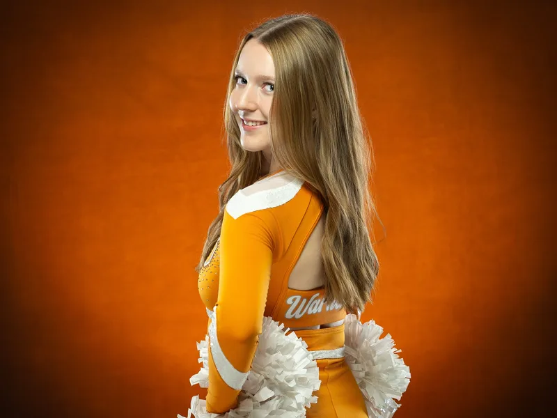 Ridgevue High School Warhawks cheerleader portrait with poms Nampa Idaho