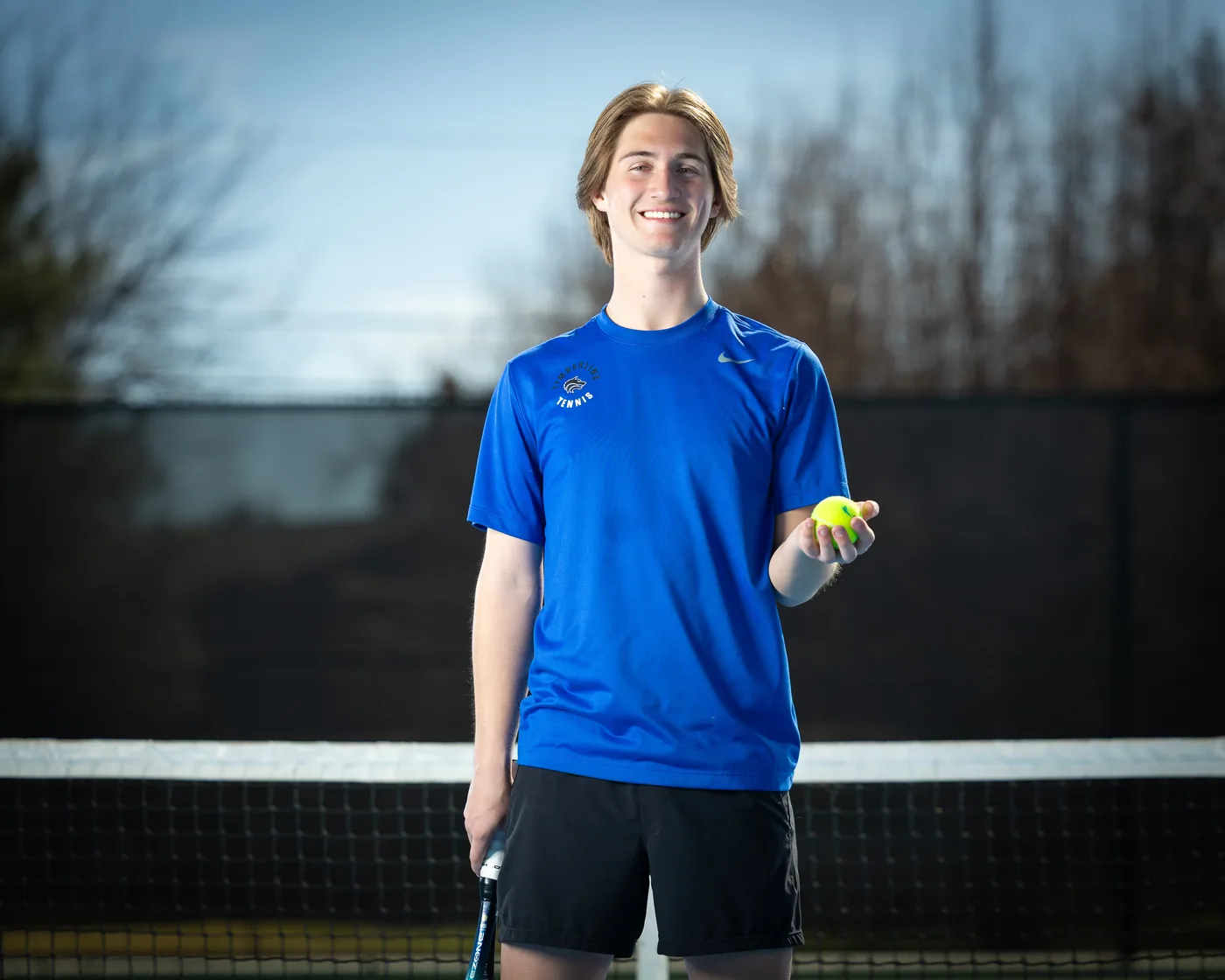 Timberline High School tennis player portrait at the net Boise Idaho
