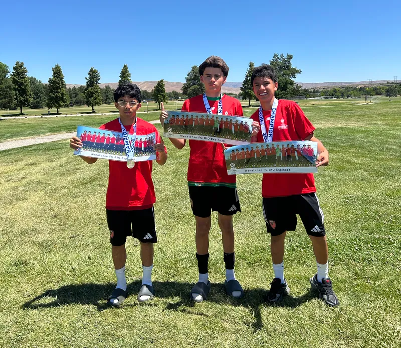 Wenatchee FC B10 Espinoza players celebrating their Northwest President's Cup Qualifier Championship with their panoramic team prints